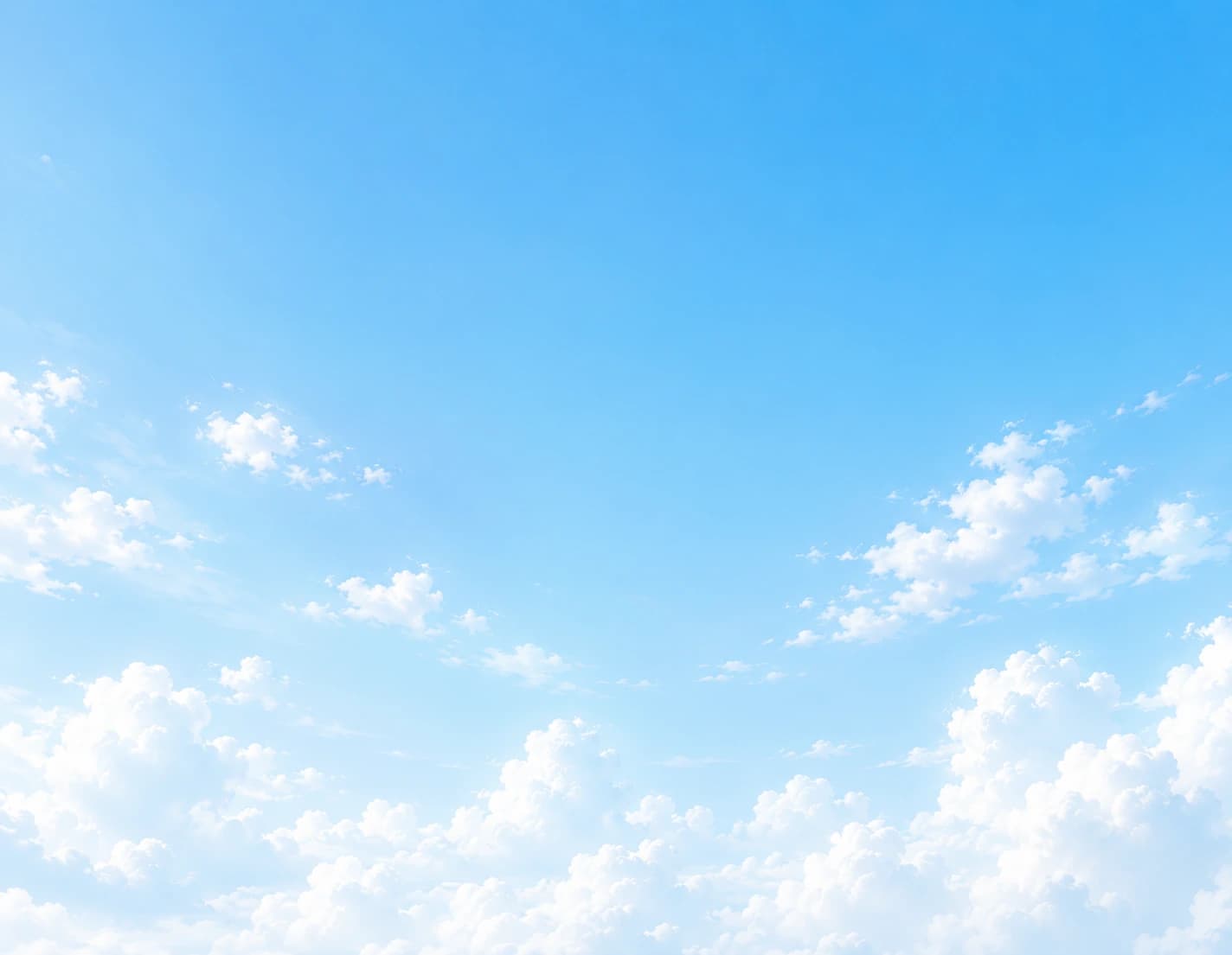 Soft clouds in a bright blue sky